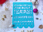 Azure Blue Turquoise save the date card with floral patterns and text on a white surface with decorative items.